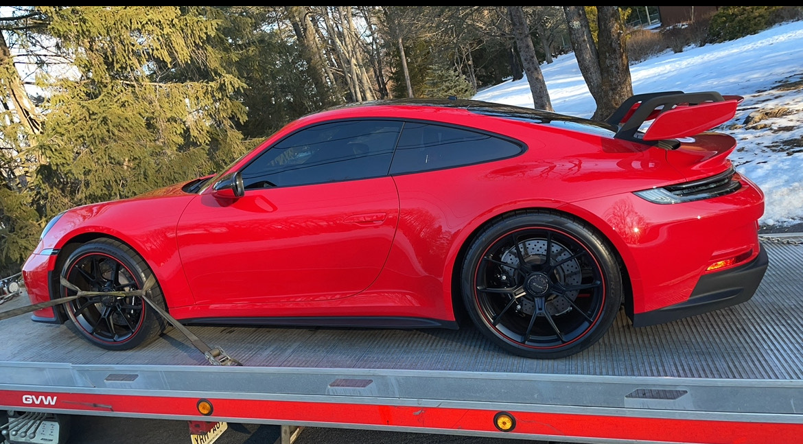 Red Porsche 911 GT3 being transported on our flatbed